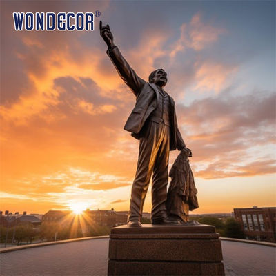 Bronze sculptures of figures in large outdoor square parks